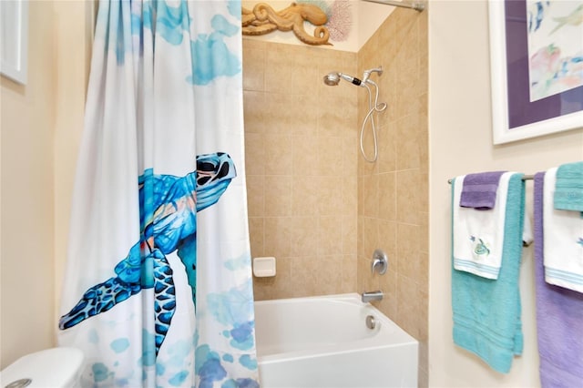 bathroom featuring toilet and shower / tub combo with curtain