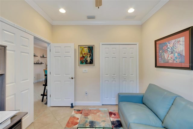 living room featuring crown molding and light tile patterned flooring