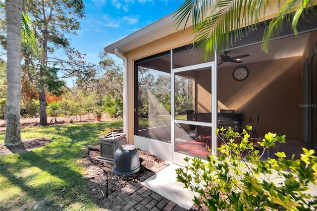 view of patio with a sunroom