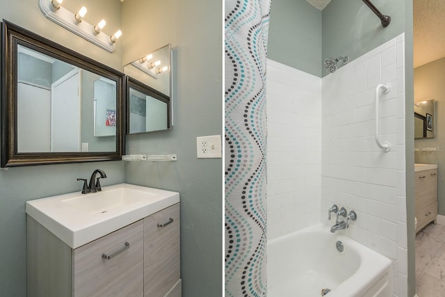 bathroom with shower / bath combination with curtain and vanity