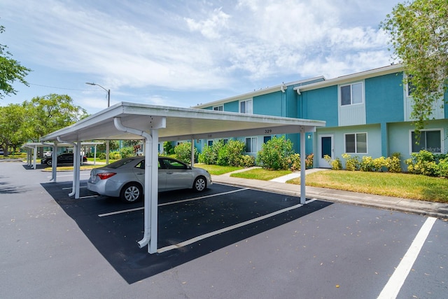 view of car parking featuring a carport