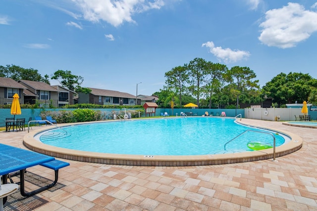 view of pool featuring a patio area