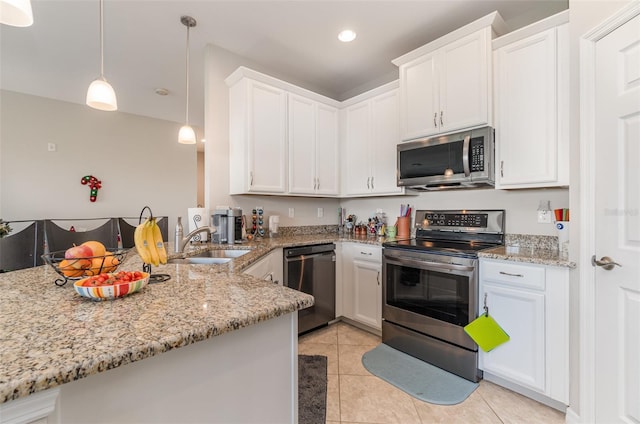 kitchen featuring pendant lighting, kitchen peninsula, white cabinetry, and stainless steel appliances