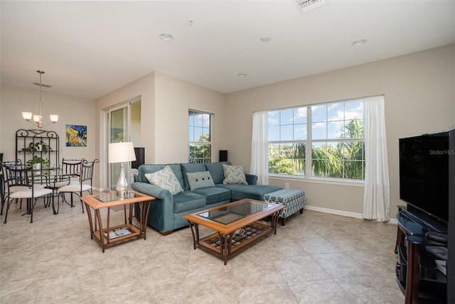 living room featuring an inviting chandelier