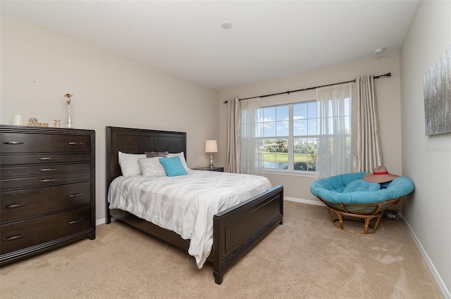 bedroom with light carpet