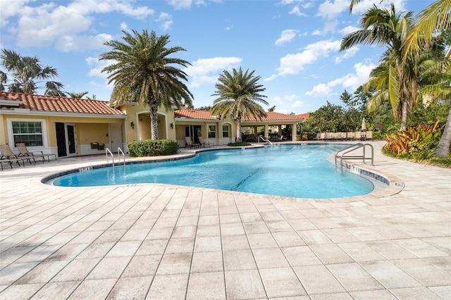 view of swimming pool featuring a patio