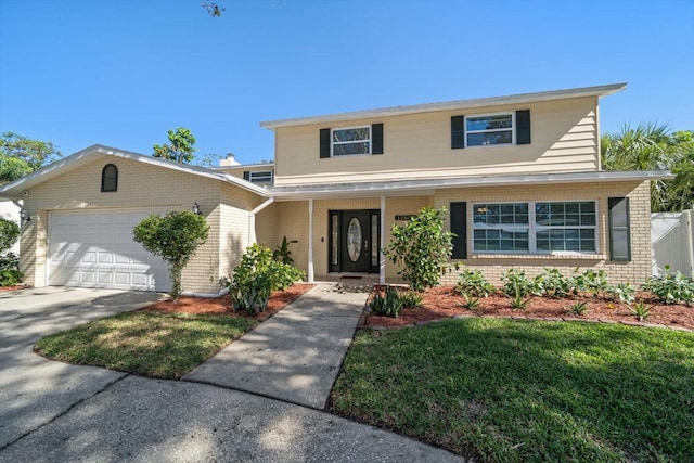 view of front property featuring a front yard and a garage