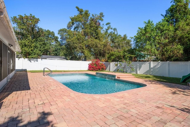 view of pool featuring pool water feature and a patio area