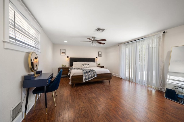 bedroom featuring ceiling fan and dark hardwood / wood-style floors