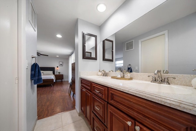 bathroom with vanity and hardwood / wood-style flooring