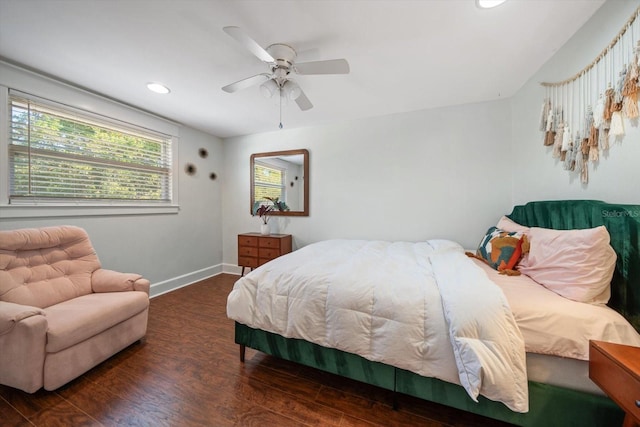 bedroom featuring ceiling fan and dark wood-type flooring