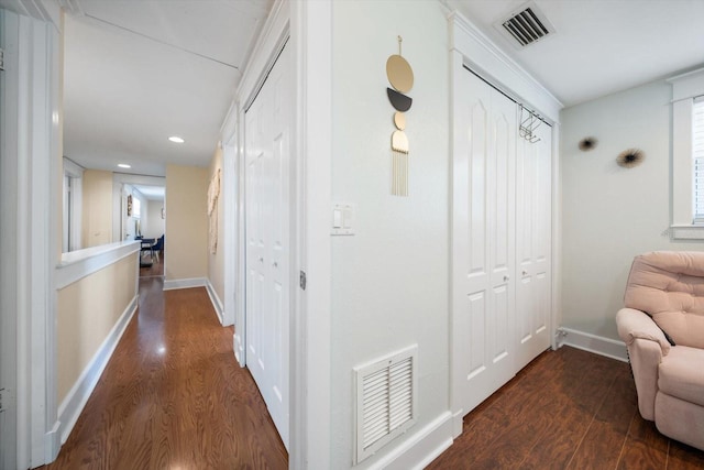 corridor featuring dark hardwood / wood-style flooring