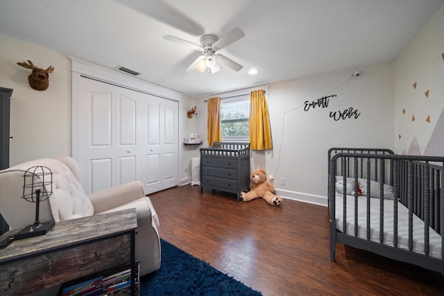 bedroom with a closet, ceiling fan, and dark hardwood / wood-style flooring