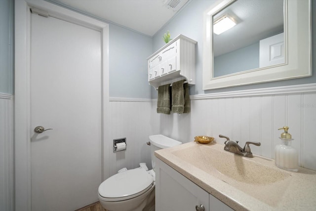 bathroom with vanity and toilet