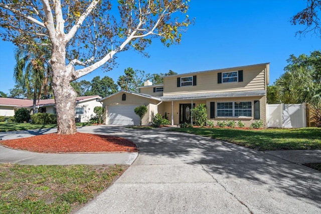 front of property with a garage and a front lawn