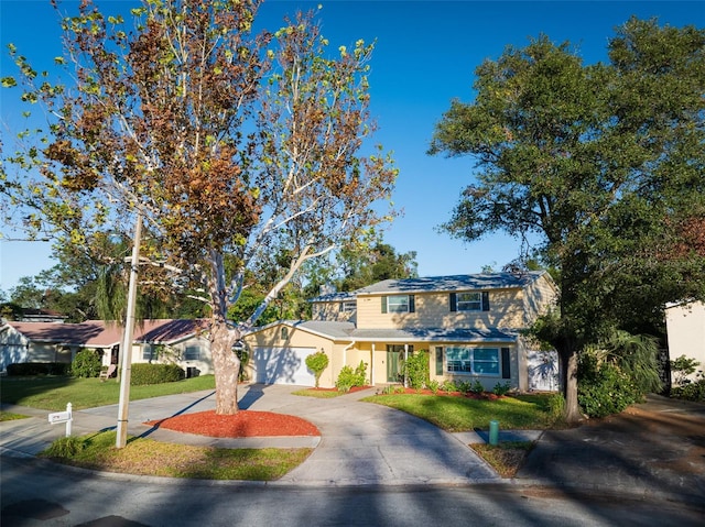 view of front facade featuring a front lawn and a garage