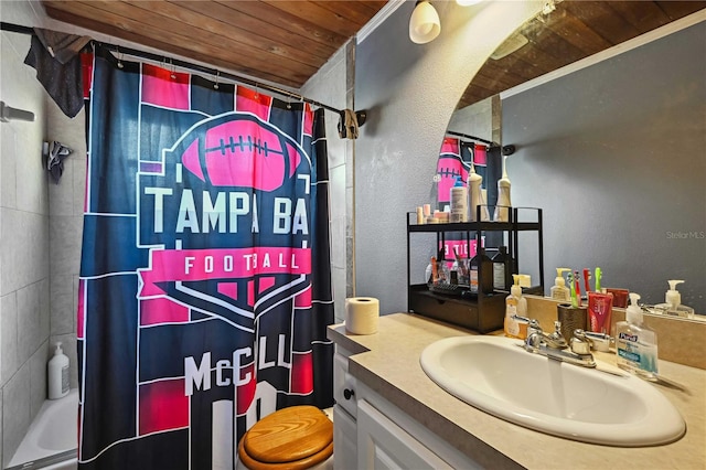 full bathroom featuring toilet, shower / bath combo with shower curtain, vanity, wood ceiling, and ornamental molding