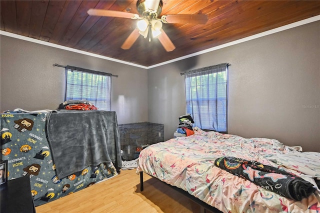 bedroom with multiple windows, wooden ceiling, ceiling fan, and ornamental molding