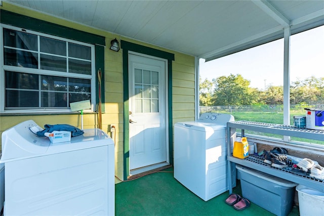 clothes washing area with wood walls and carpet