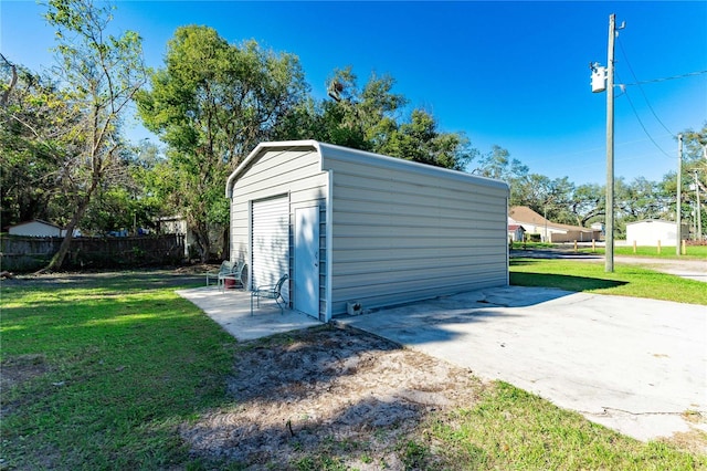 view of outbuilding featuring a yard