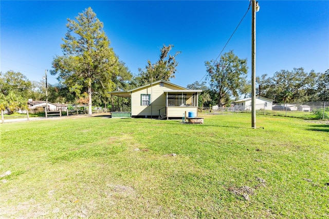 view of yard featuring a sunroom