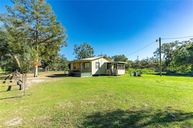 view of yard featuring a sunroom