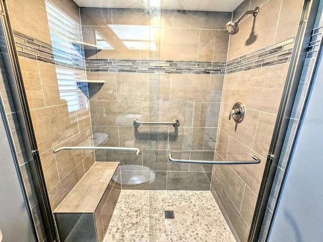 bathroom featuring an enclosed shower