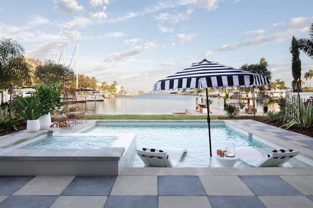 view of swimming pool featuring a water view