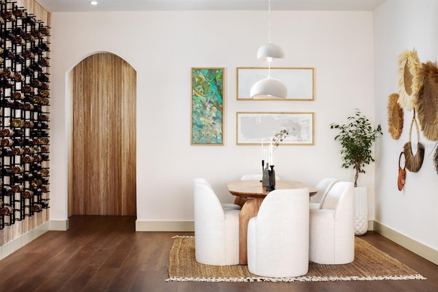 dining area with dark hardwood / wood-style floors