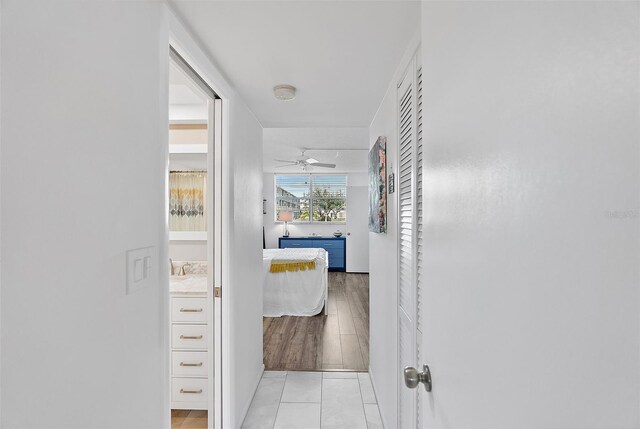 4915 Bay St NE Unit 130, Saint Petersburg, FL 33703 - hallway featuring light tile patterned floors
