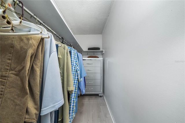 walk in closet featuring hardwood / wood-style floors