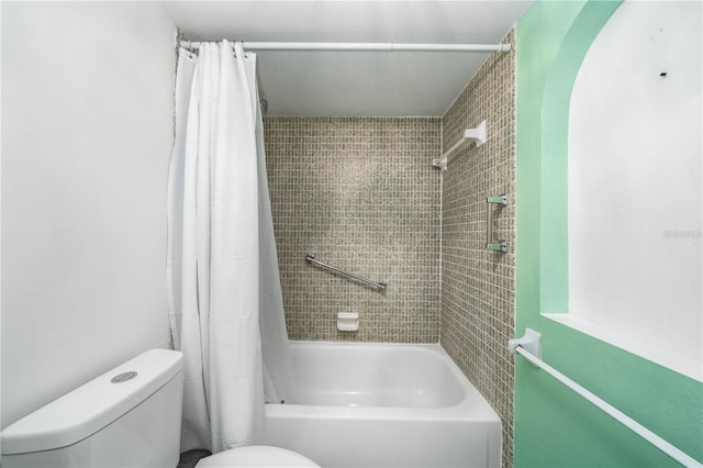 bathroom with shower / bath combo and toilet