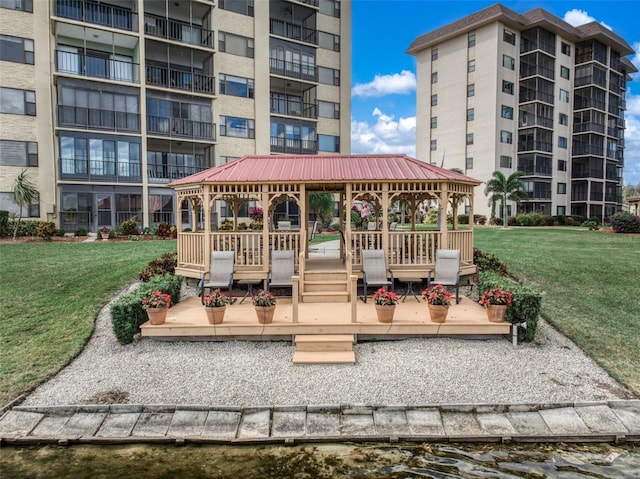 view of property's community with a gazebo and a lawn