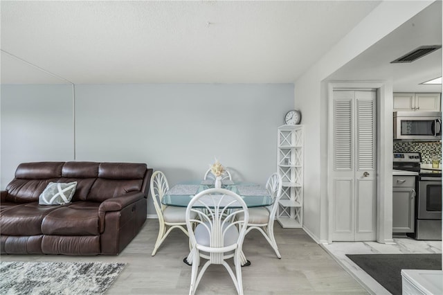 dining area featuring light hardwood / wood-style flooring