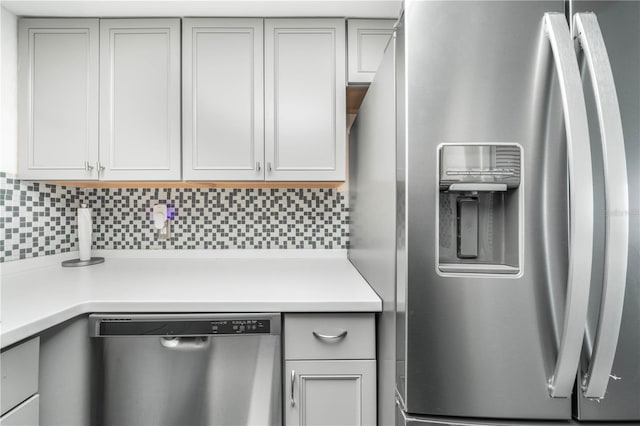 kitchen featuring backsplash and stainless steel appliances