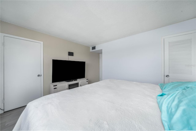 bedroom featuring light colored carpet