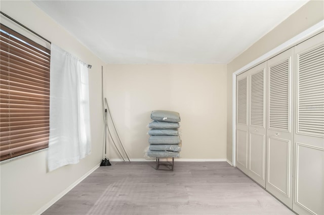 unfurnished room with light hardwood / wood-style flooring