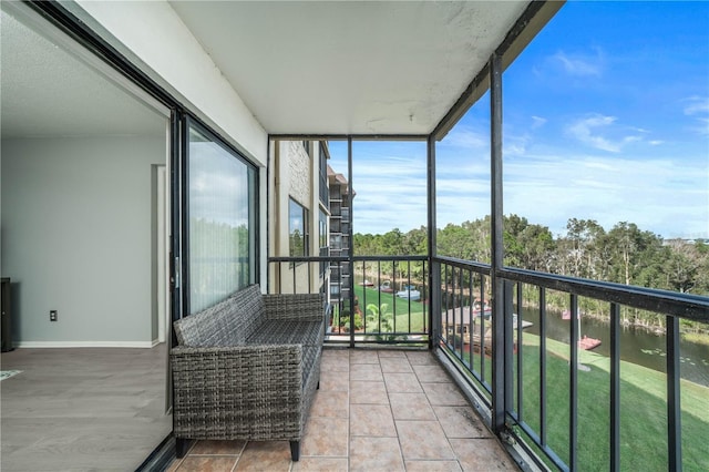 balcony featuring a water view