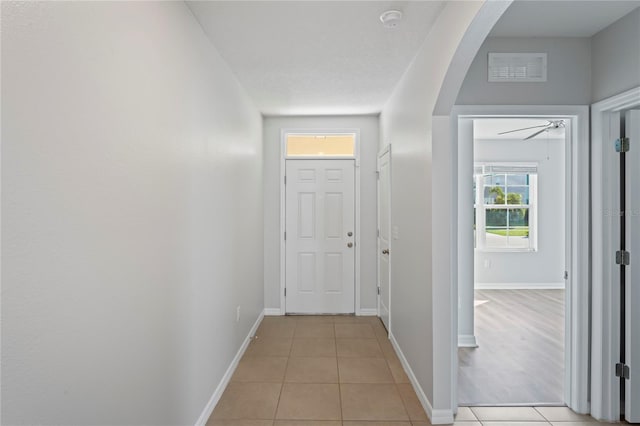 hallway with light tile patterned floors