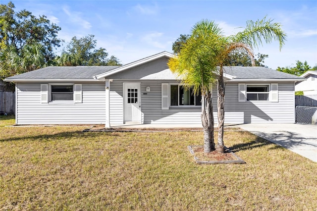 single story home featuring a front yard