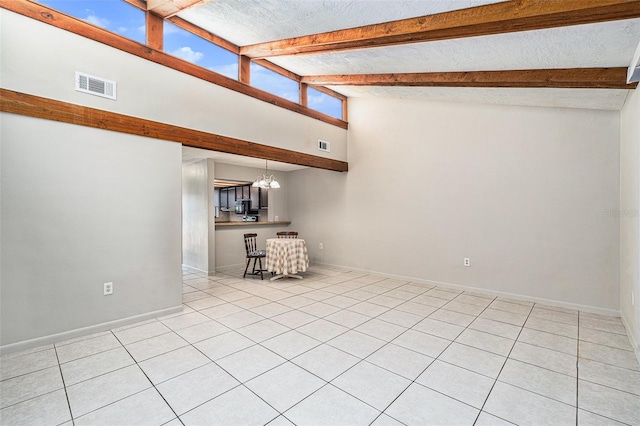 interior space featuring beamed ceiling, high vaulted ceiling, an inviting chandelier, and light tile patterned flooring