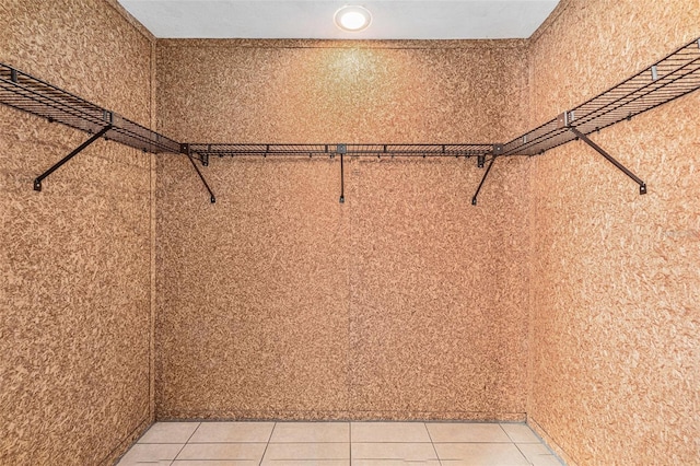 spacious closet featuring tile patterned floors