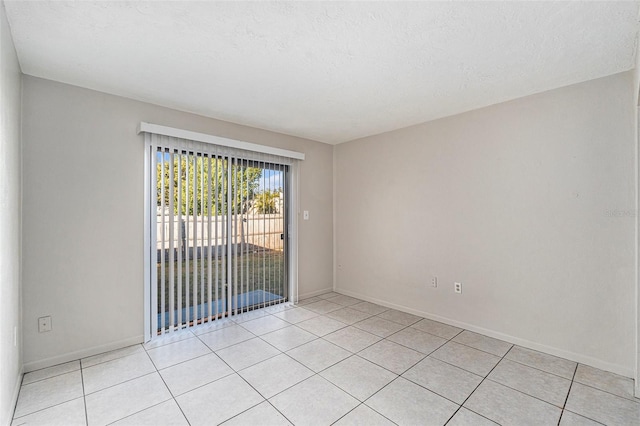 view of tiled spare room