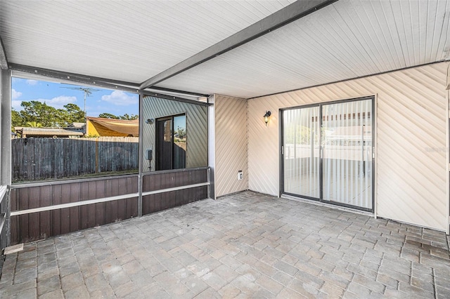 unfurnished sunroom featuring plenty of natural light