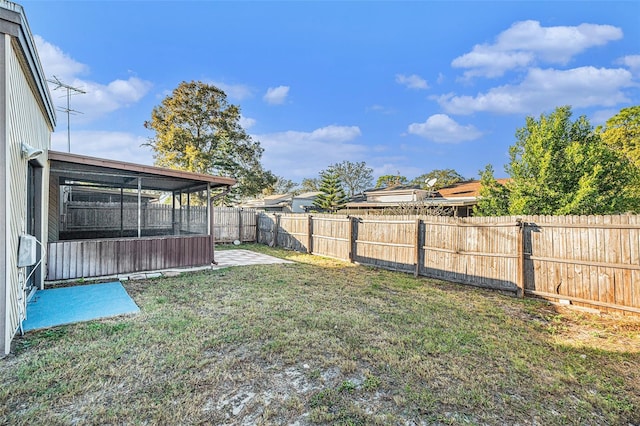 view of yard with a sunroom