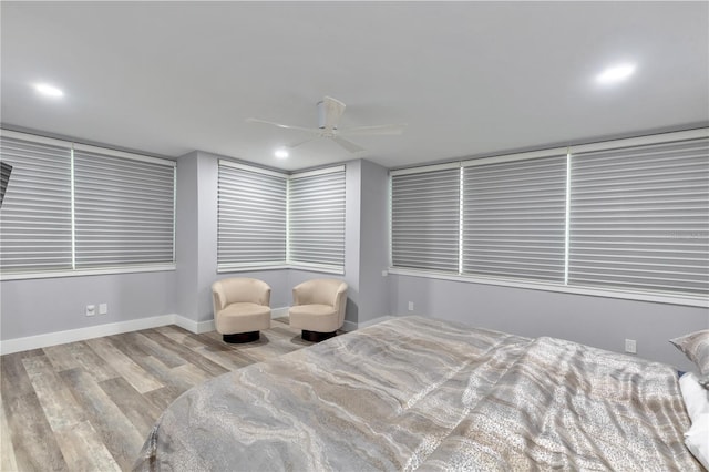 bedroom with ceiling fan and light wood-type flooring