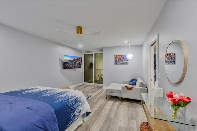 bedroom featuring ceiling fan and wood-type flooring