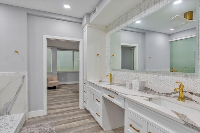 bathroom with vanity and hardwood / wood-style flooring