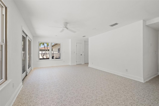 unfurnished living room featuring ceiling fan