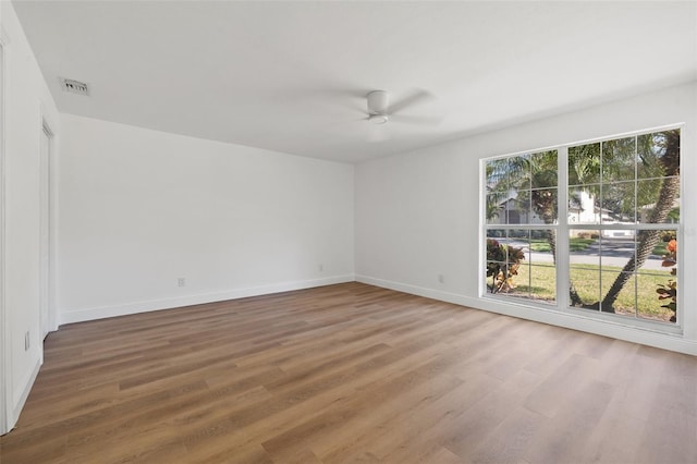 spare room featuring ceiling fan and hardwood / wood-style floors